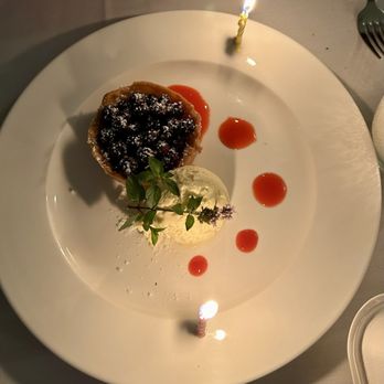 Bistro de Margot - They did a joint birthday candle dessert for us (berry tart dessert) - French Near Me - Burlington, Vermont Bistro de Margot - They did a joint birthday candle dessert for us (berry tart dessert) - French Near Me - Burlington, Vermont