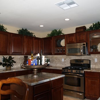 Beehive Ceilings - a kitchen with wood cabinets and granite countertops - General Contractors Near Me Beehive Ceilings - a kitchen with wood cabinets and granite countertops - General Contractors Near Me