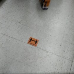 Social distance stickers on the ground floor to remind people give them space ( during covid 19)