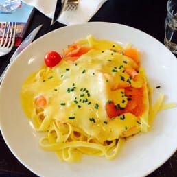 Smoked salmon pasta with fresh tomatoes and creamy cheese sauce. Smoked salmon pasta with fresh tomatoes and creamy cheese sauce.