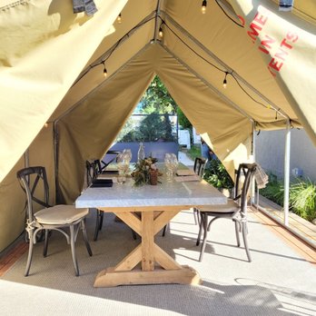Auteur Wines - a table and chairs in a tent - Wineries Near Me - Sonoma, California