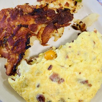 Haddon Diner - I asked for well done home fries with my bacon and cheese omelette - A breakfast plate featuring scrambled eggs with bits of bacon and a side of crispy bacon strips. - Diners Near Me - Haddon Township, New Jersey