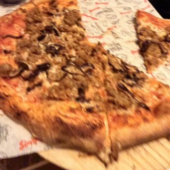 Simmzy's - Half eaten MSG pizza - Gastropubs Near Me - Long Beach, California Simmzy's - Half eaten MSG pizza - Gastropubs Near Me - Long Beach, California