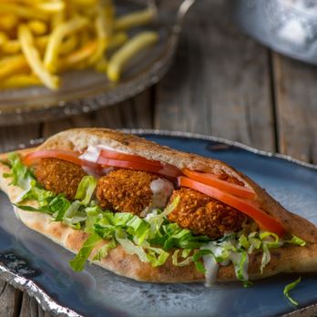 Malek Shawarma - Falafel Wrap
 Mixture of fava beans, chickpeas, and Malek spices formed into balls  and fried until golden served in a pita wrap with fresh - Mediterranean Near Me - Oakville, Ontario