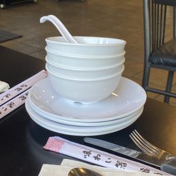 Drops bowls and plates on table Drops bowls and plates on table