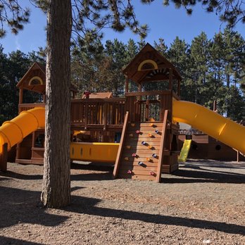 Hayward KOA - Large playground for 2-12 year olds. Our 1 1/2 year old played very well on it - Campgrounds Near Me - Hayward, Wisconsin