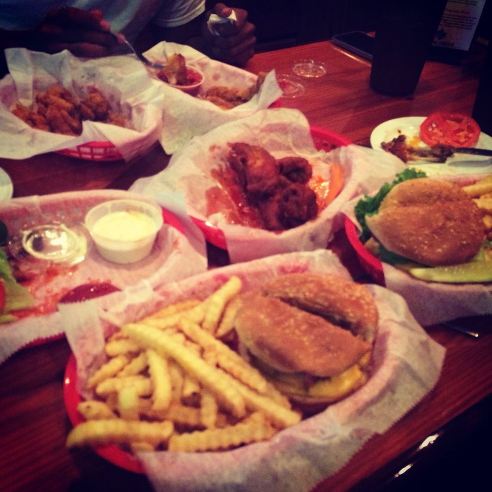 Brass Ring Pub - Bacon cheeseburger & hot wings with crinkly fries - Sports Bars Near Me - Royal Palm Beach, Florida