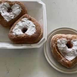 Glazed Cronut on the right and Cinnamon sugar on the left Glazed Cronut on the right and Cinnamon sugar on the left