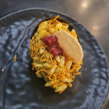Farzi Cafe - Avocado & chutney with puffed rice and pomegranate seeds - Indian Near Me - Bellevue, Washington Farzi Cafe - Avocado & chutney with puffed rice and pomegranate seeds - Indian Near Me - Bellevue, Washington