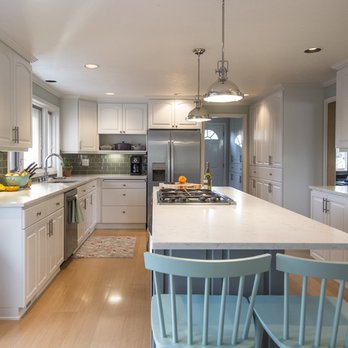 Untamed Construction - a clean kitchen with white cabinets - General Contractors Near Me
