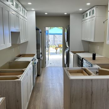 Carpentry Time - Kitchen cabinet installation in progress with full layout aligned for a clean, functional and well-balanced design. - General Contractors Near Me - Boynton Beach, Florida