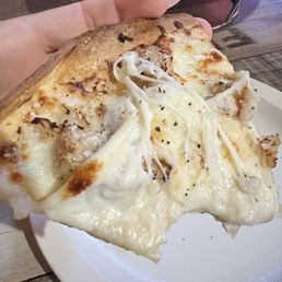 Thin crust chicken Alfredo pizza. Cheese is super stringy when hot. Yum!