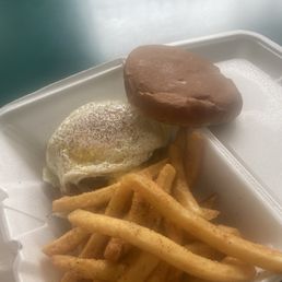 Cheese Burger with a fried egg and fries