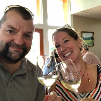 Crushed Cellars - a man and a woman holding wine glasses - Wineries Near Me - Purcellville, Virginia