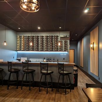 Lane Cellars - a bar with stools and a wine rack - Wine Bars Near Me - Camas, Washington Lane Cellars - a bar with stools and a wine rack - Wine Bars Near Me - Camas, Washington