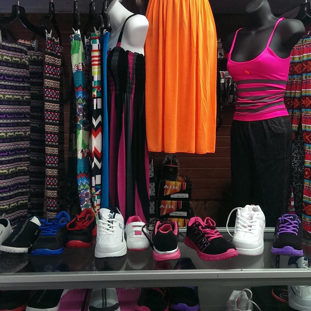 Tomgro Grocery - a display of clothing and shoes - Grocery Near Me - Austin, Texas