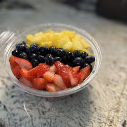 Juggling Juices and Bowls - One of our most popular bowls, the Jungle Bowl! It consists of Acai, granola, honey, strawberries, blueberries, pineapples, coconut!