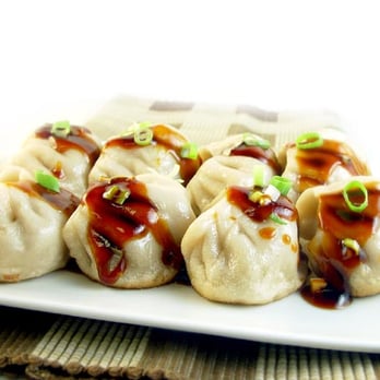 New China Express - a plate of dumplings with sauce - Chinese Near Me - Powell, Ohio New China Express - a plate of dumplings with sauce - Chinese Near Me - Powell, Ohio