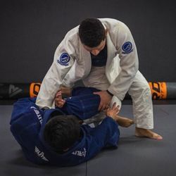 Legends Martial Arts - Coach Mike Davila passes the guard during live drills.