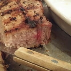 Buford's Steakhouse & BBQ - Undercooked grilled pork chop.