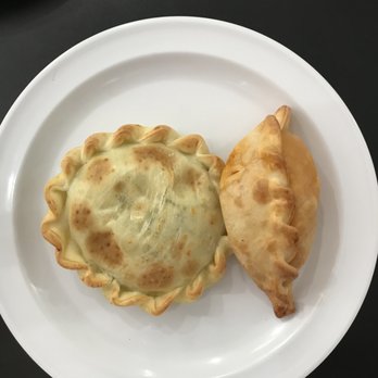 MMM Que Rico - Spinach and ricotta cheese empanada on the left and beef empanada on the right. - Peruvian Near Me - Calabash, North Carolina MMM Que Rico - Spinach and ricotta cheese empanada on the left and beef empanada on the right. - Peruvian Near Me - Calabash, North Carolina