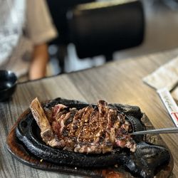 1. Artist Steak: Rib Eye Steak over sizzling plate Served with a side salad and choice of Fries or Garlic Rice