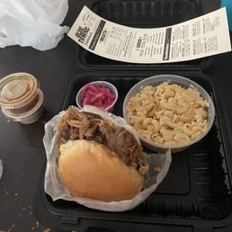 Pull pork sandwich, side mac n cheese and side of pickled red onions and two sauces. Pull pork sandwich, side mac n cheese and side of pickled red onions and two sauces.