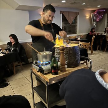 Risotto Restaurant - Pasta is mixed inside cheese wheel - Italian Near Me - Thornwood, New York Risotto Restaurant - Pasta is mixed inside cheese wheel - Italian Near Me - Thornwood, New York