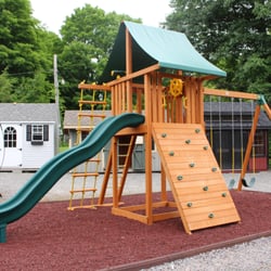 Best In Backyards - The Ultimate Cedar Swing Set (by Eastern Jungle Gym) on display at Best in Backyards in Danbury, CT.