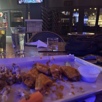 Brick Top's Pub - Brand new wings, and furniture stacked - Burgers Near Me - Austin, Texas Brick Top's Pub - Brand new wings, and furniture stacked - Burgers Near Me - Austin, Texas