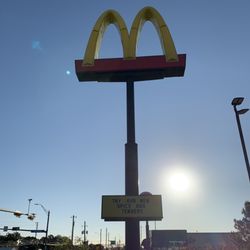 Sign for McDonalds with daily and weekly specials.