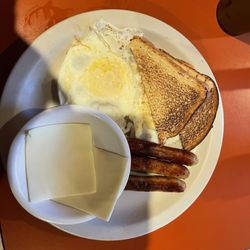 Rosaria's Diner - Eggs toast link sausages with white American cheese on the side.