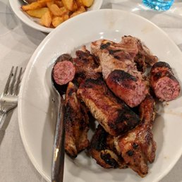 Grilled pork chops, ribs, and sausages Grilled pork chops, ribs, and sausages