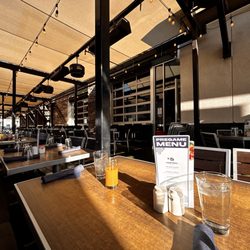 Hash Kitchen - Outdoor dining area/ ordered Queso Birria Benedict and fruit dish