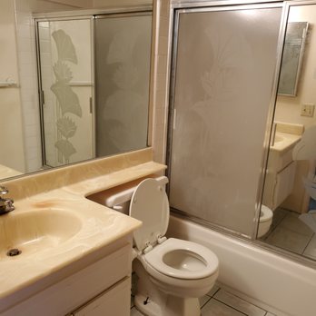 Verona KBF - Before: Ugly toilet and bathtub with glass door - Flooring Near Me - Laguna Hills, California Verona KBF - Before: Ugly toilet and bathtub with glass door - Flooring Near Me - Laguna Hills, California