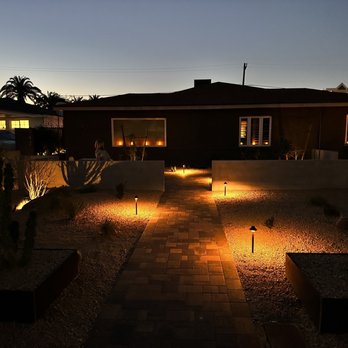 Tranquil Oasis Landscapes - a house at night - Landscaping Near Me
