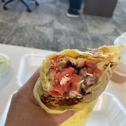 Fast Taco - Inside a loaded Carne Asada burrito; rice, beans, cheese, Carne, Asada, and pico de gallo