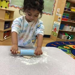 The Goddard School of San Ramon - Rolling dough for a fun activity