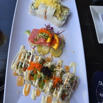 Pisces Sushi & Global Bistro - .salmon crunch at the top, tuna sashimi, Everything Bagel roll at the bottom. All delicious! - Sushi Bars Near Me - Dunedin, Florida Pisces Sushi & Global Bistro - .salmon crunch at the top, tuna sashimi, Everything Bagel roll at the bottom. All delicious! - Sushi Bars Near Me - Dunedin, Florida