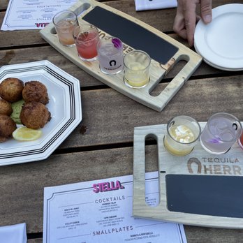 STELLA - The Margarita flight, and cod fritters, both of which were delicious. - New American Near Me - Seattle, Washington
