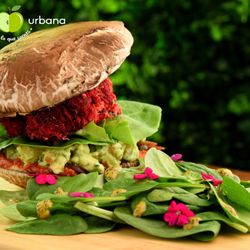 Campiña Urbana - Raw burger ! The "bread " are the portobello !!  Beet / carrot patty, cashew dressing, guacamole and tomato sauce .