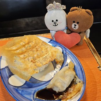 Karami Ramen - Dipping a gyoza in the sauce - Ramen Near Me - San Diego, California