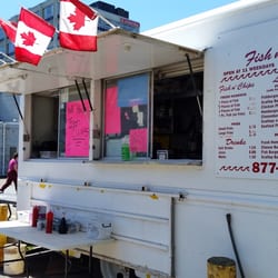 King Street Fish & Chips - Street side of patriotic food truck. Picnic tables to left.