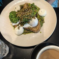 Maple & Clove - Poached eggs with pesto and goat cheese.