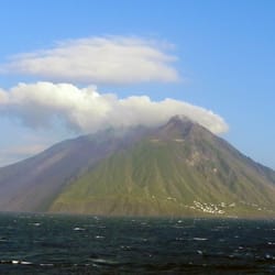 Stromboli - The lava flow runs down the side on the left, people live not far from it to the right