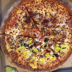 Papa Johns Pizza - Whole meat, a few olives and banana peppers on half