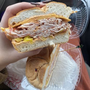 Cameron's Deli - a person holding a sandwich - Delis Near Me - Queensbury, New York Cameron's Deli - a person holding a sandwich - Delis Near Me - Queensbury, New York