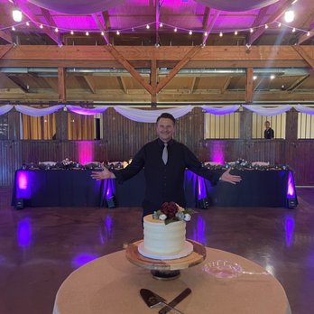 Dj On Demand - Me in front of the cake with uplighting in the background. - DJs Near Me - Cincinnati, Ohio Dj On Demand - Me in front of the cake with uplighting in the background. - DJs Near Me - Cincinnati, Ohio