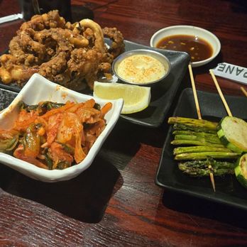 Izakaya Go - Beef tongue skewers, fried tentacles, kimchi, asparagus skewer, zucchini skewer, chicken skin skewer - Sushi Bars Near Me - Las Vegas, Nevada