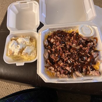 Rollin Smoke BBQ - a takeout box with a pulled pork sandwich - Barbeque Near Me - Johnson City, Tennessee